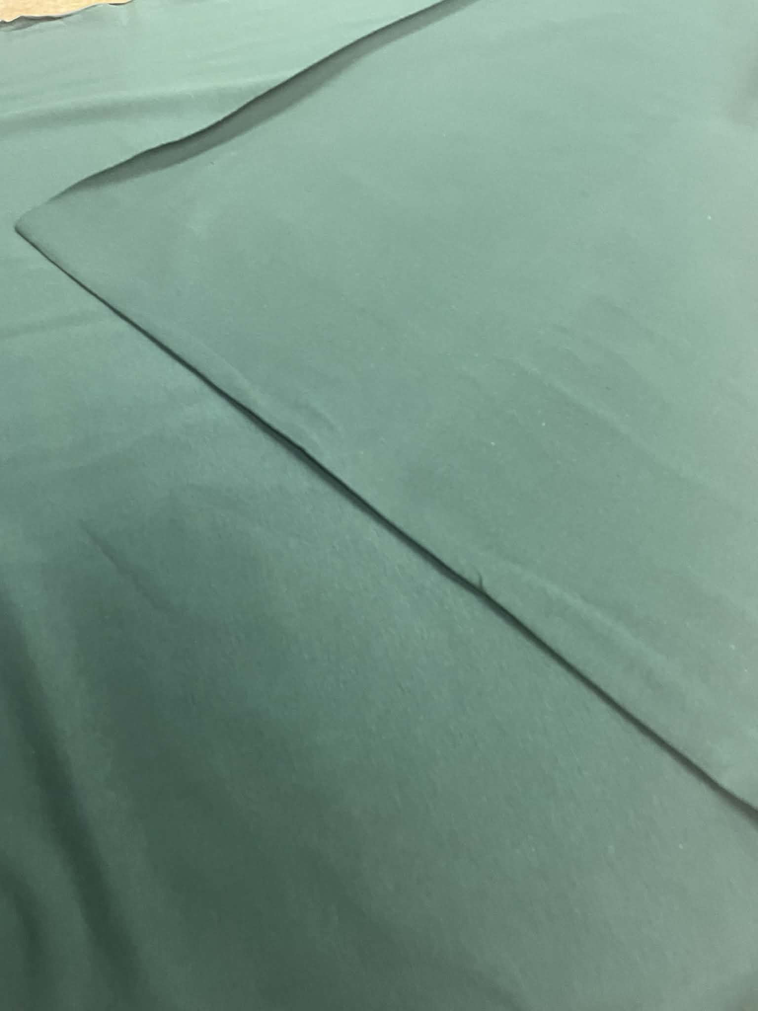 Kilpinis trikotažas "Tamsiai žalia”